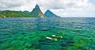 Snorkeling Over Pristine Reefs with Stunning Piton Backdrop