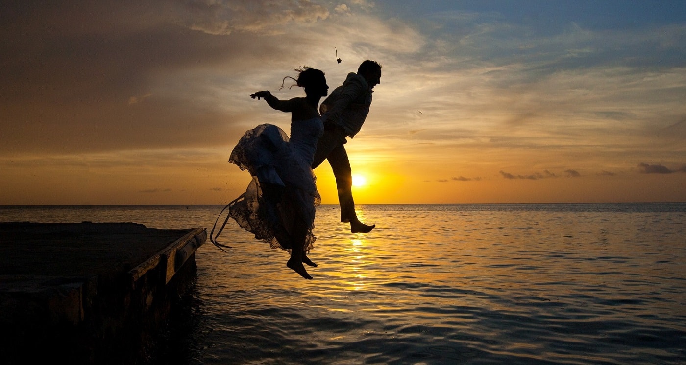 wedding couple jumping off anse chastanet jetty